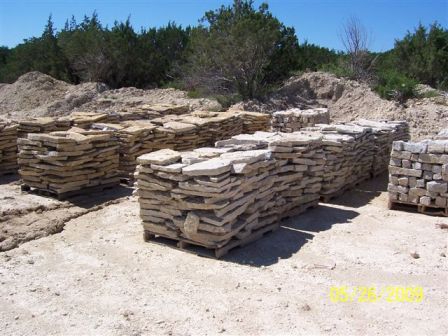 Multicolor on patio on pallets with white granbury behind it.